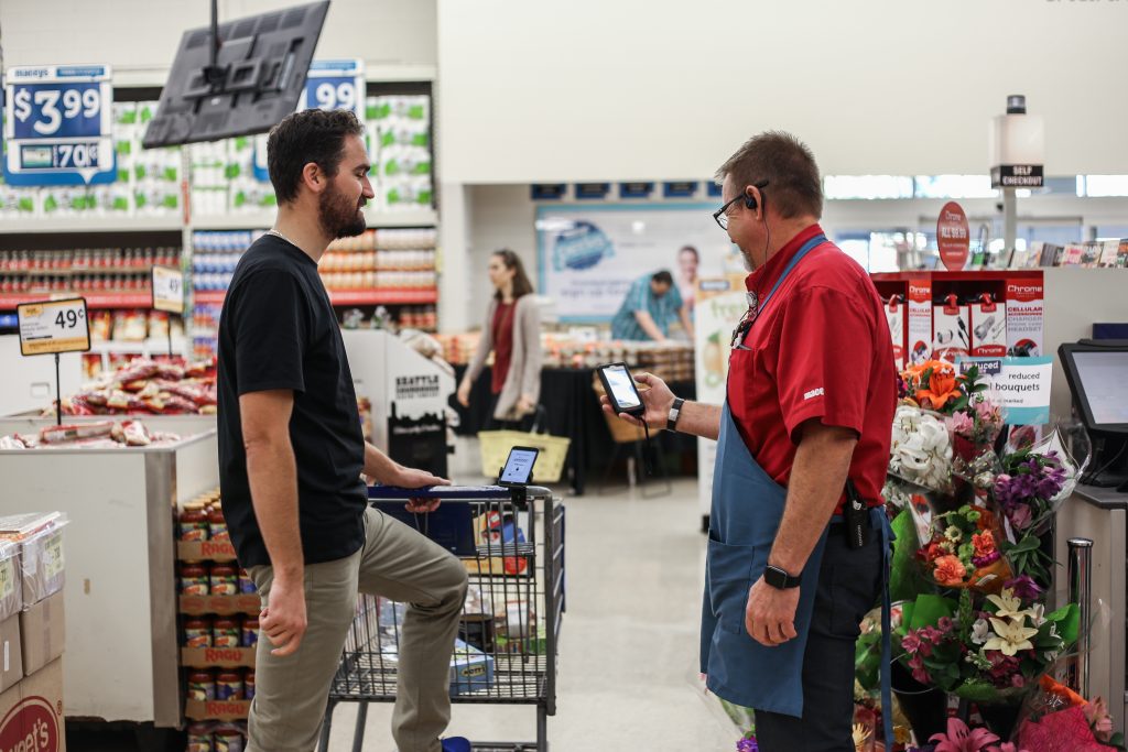A Macey's customer using Skip pauses for the 15-second checkout. (Photo by Skip)