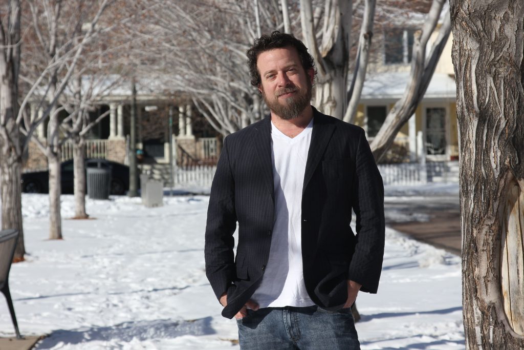 Jeff Dorchester stands outside in Denver.