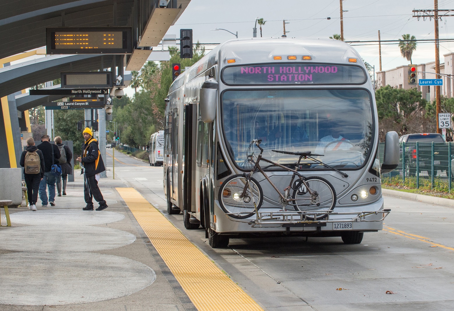 Front view of LA Metro bus at a bus stop