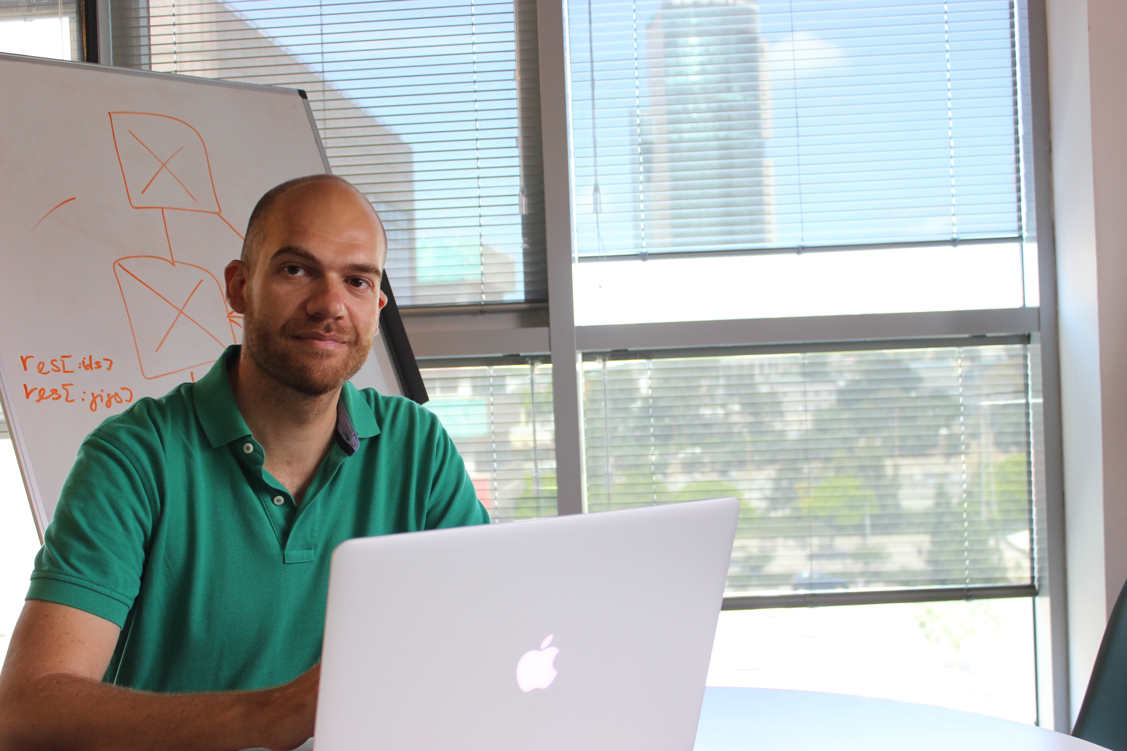 An image of Yevgeniy Kuznetsov sitting at his laptop.