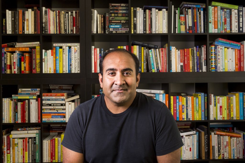 Portrait of Rohit Bhargava in front of book shelf