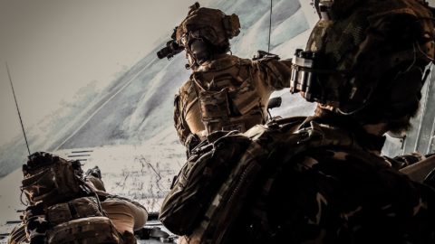 Three U.S. solders working in military gear