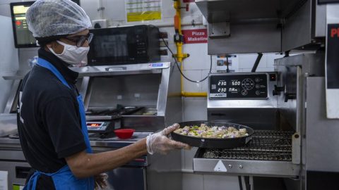A food service worker in India