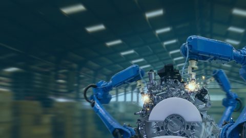A conceptual photo of a robot in a factory to illustrate smart manufacturing