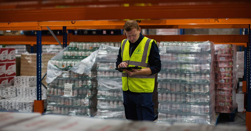 An employee prepares delivery orders at the FoodCloud warehouse in Dublin