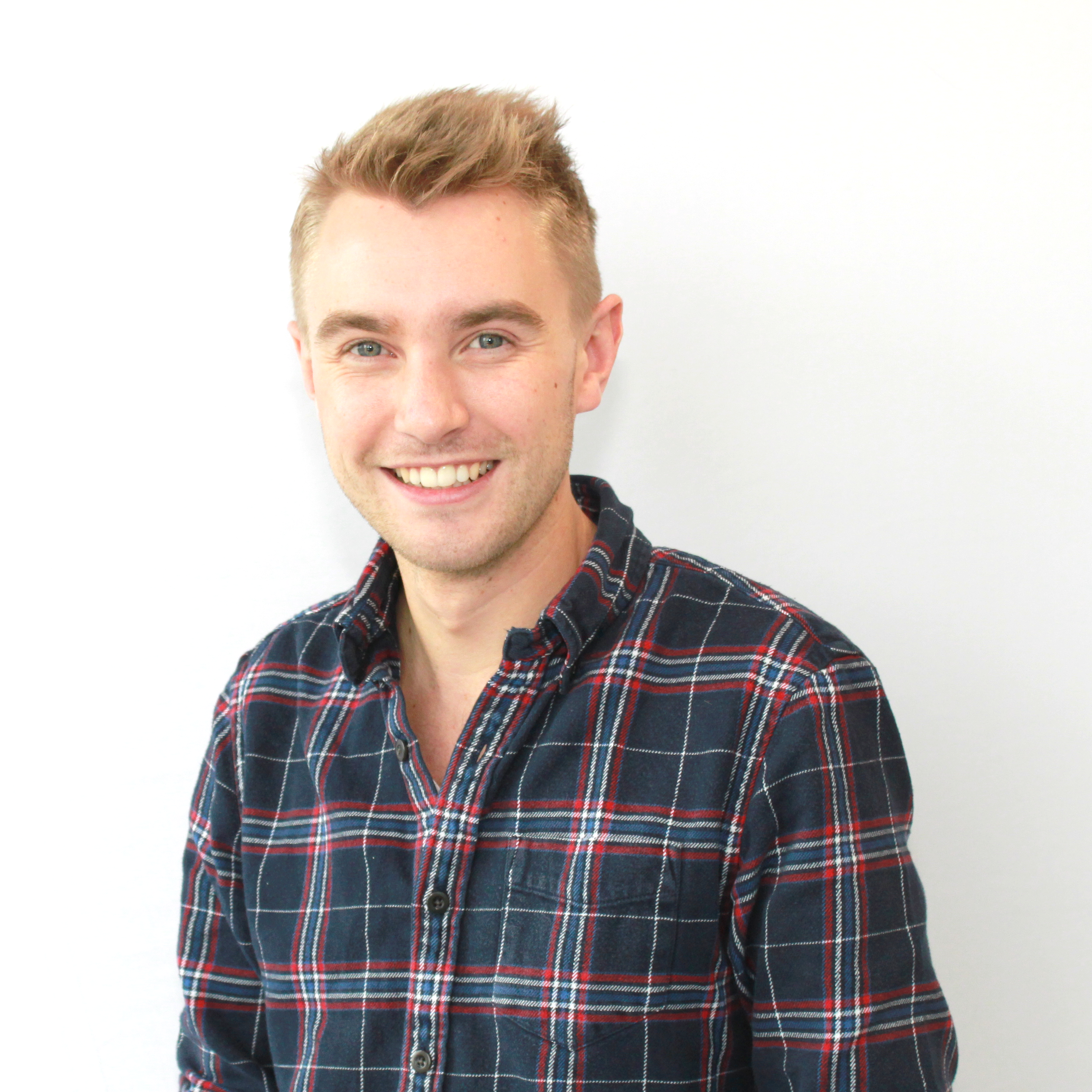 Profile picture of person in a plaid shirt