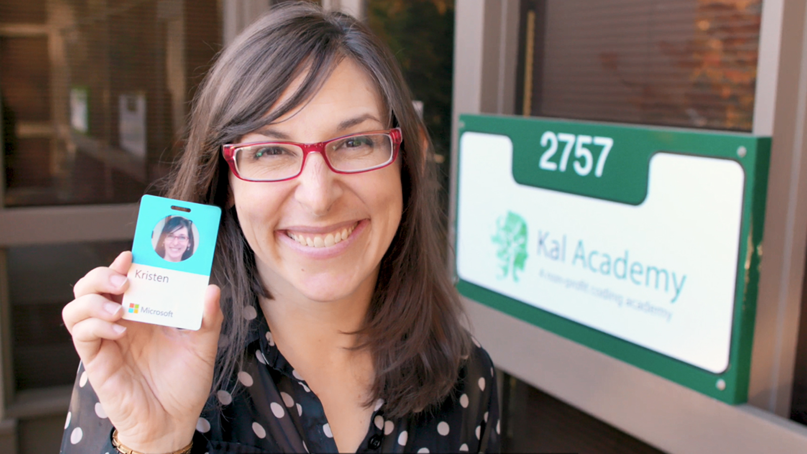 Kristen Thayer holding her Microsoft employee ID