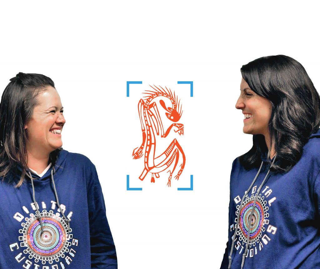 two women smiling at each other