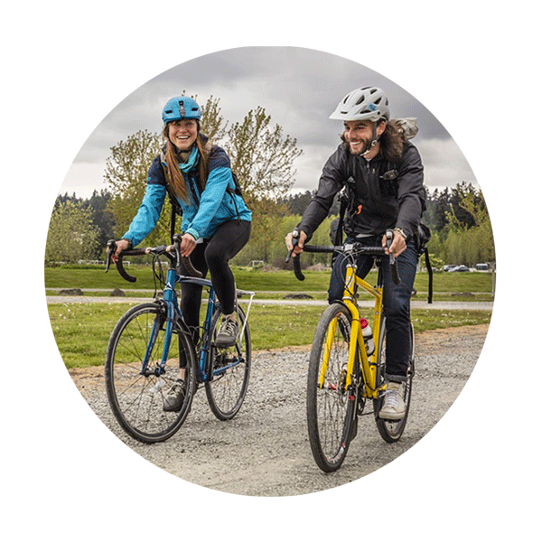 A man and a woman on their bikes