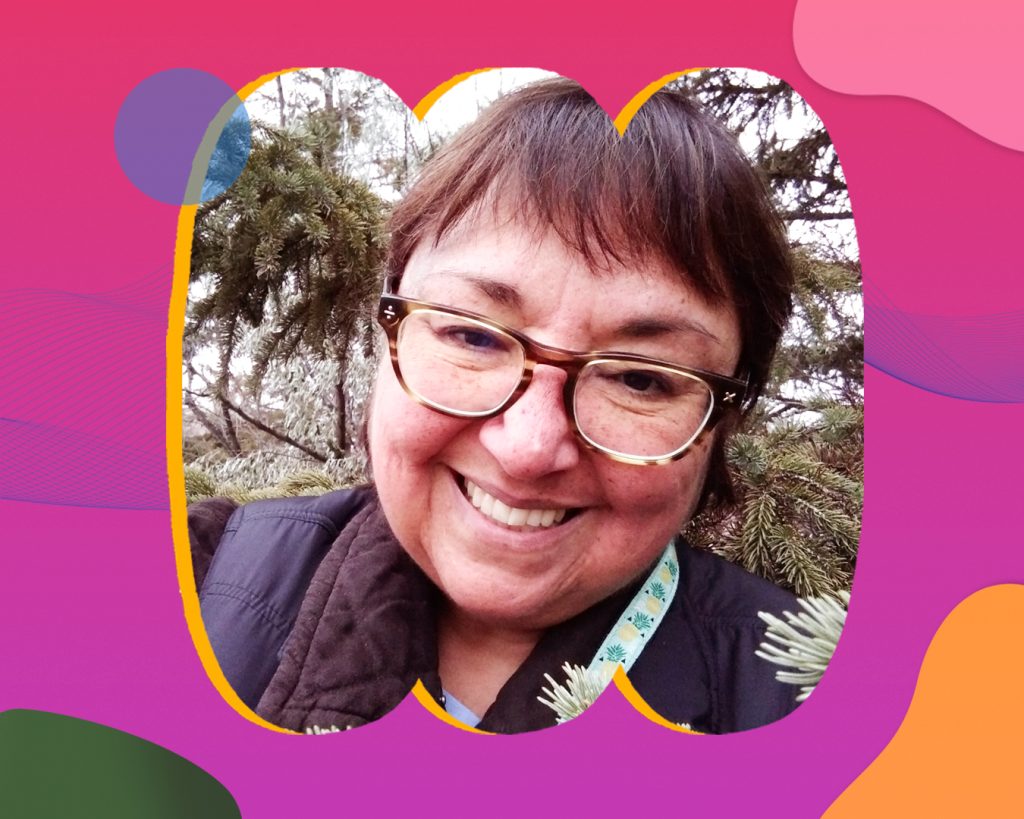 Deanna outside, looking into the camera while smiling.