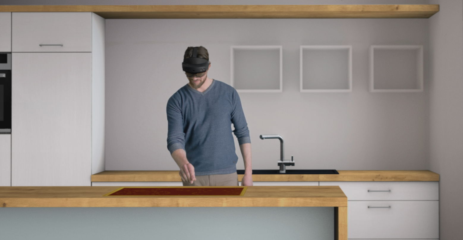 Mann steht in einer Küche und trägt eine Microsoft HoloLens 2