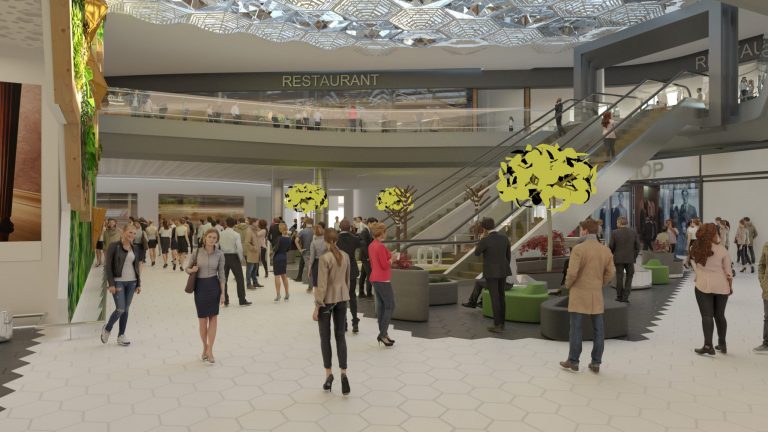 área interna de um aeroporto com escada rolante e pessoas