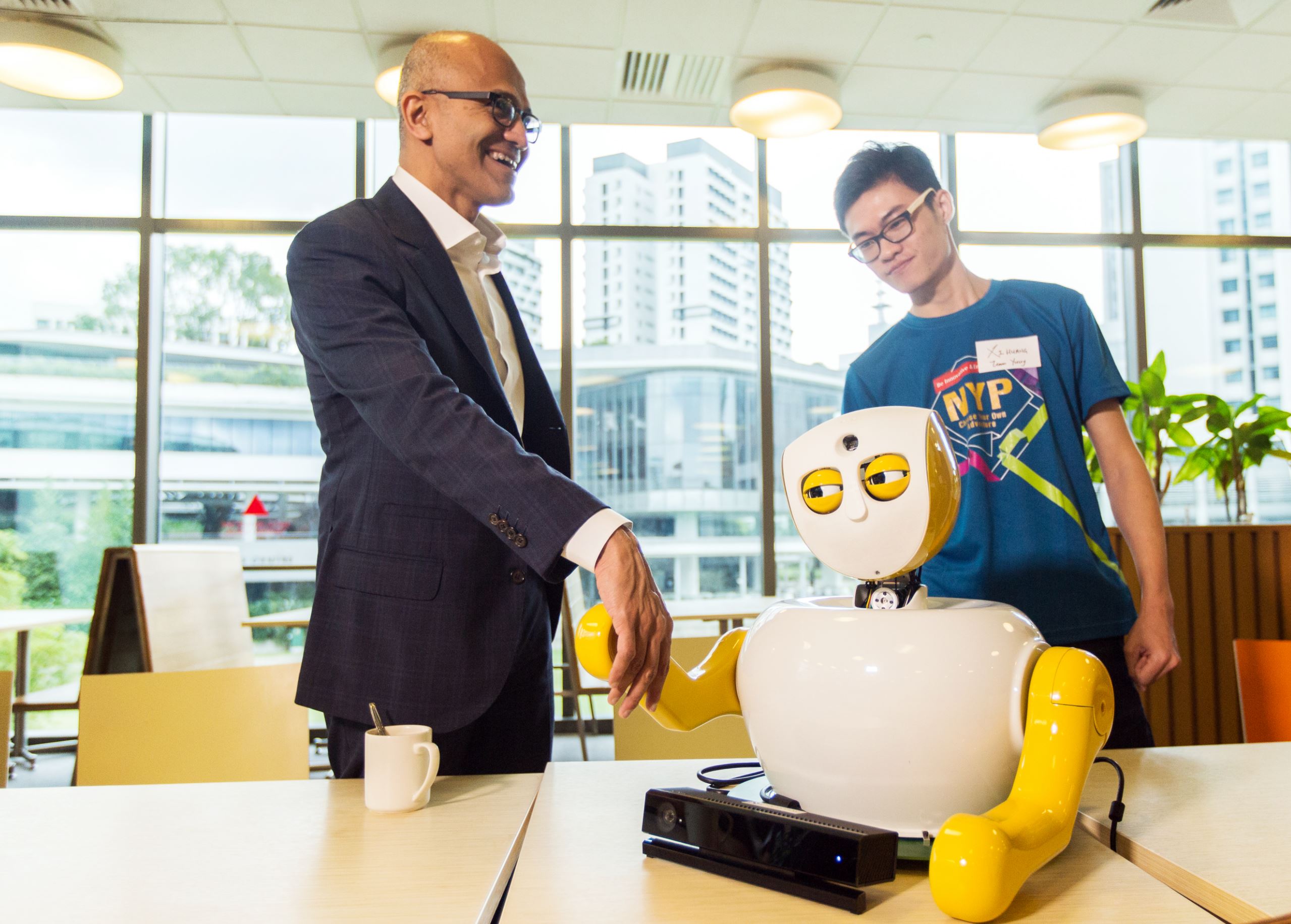 Satya interacts with Ruth the robot