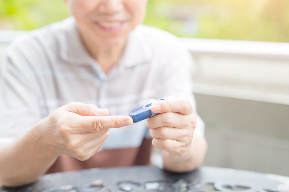 A man tests conducts a blood sugar test