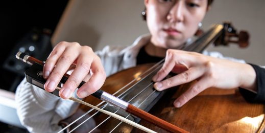 A woman plays a cello