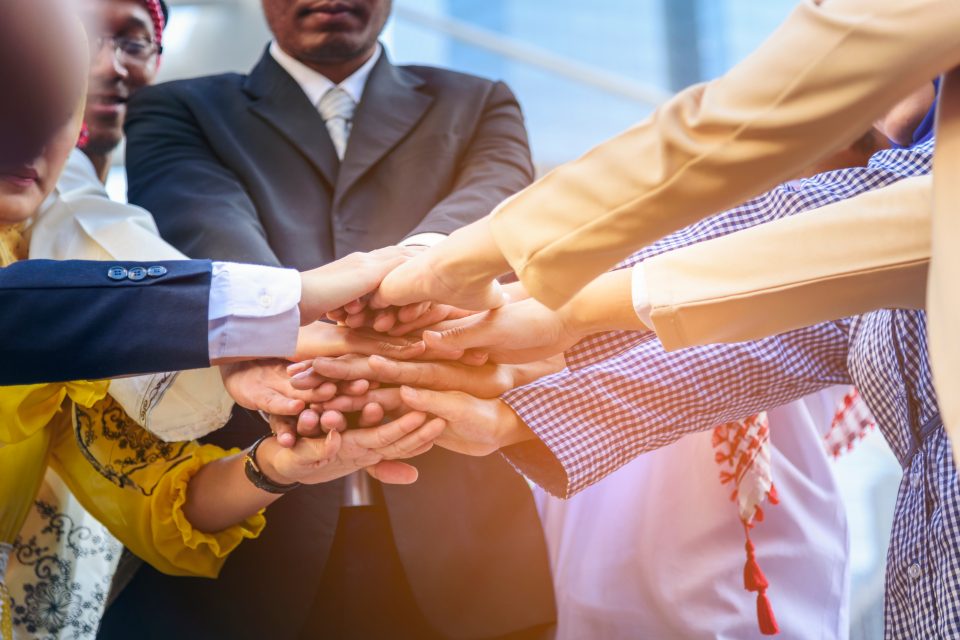 people putting their hands