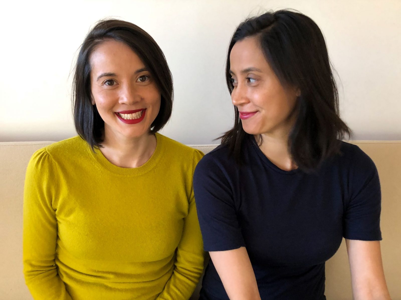 two women sitting next to each other