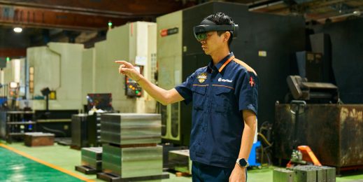 King Steel worker on the factory floor of King Steel using is wearing a mixed reality headset.