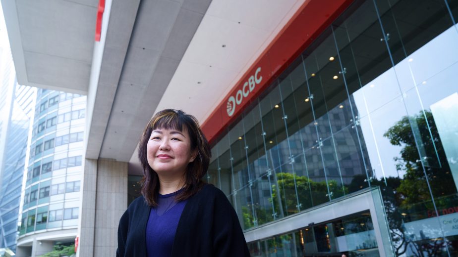 A woman standing in front of a building
