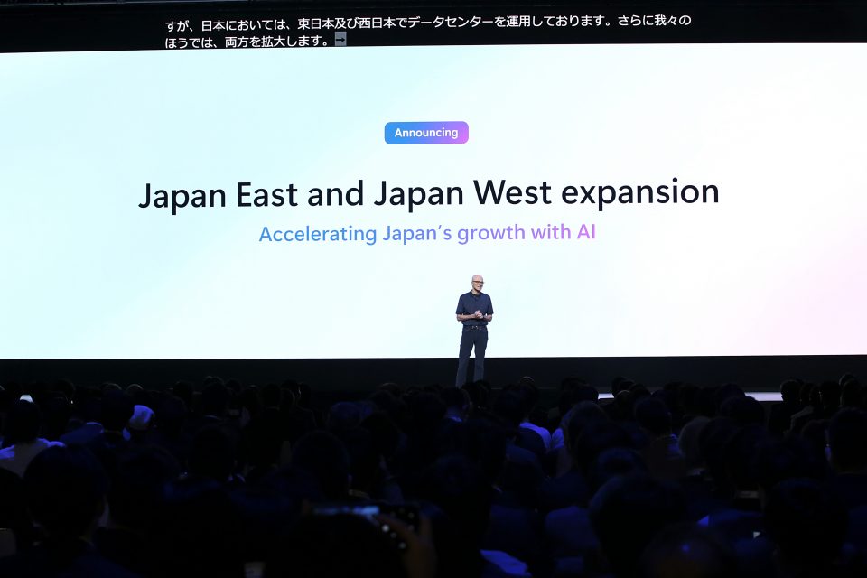 Man on stage presenting