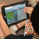 A child coding using the Minecraft tutorial