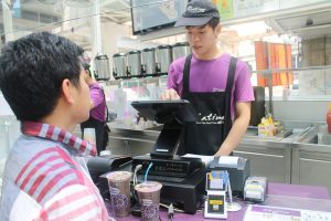 Chatime's cashier Choong keys in personalized customer orders using the new POS system running on Windows and Azure_2