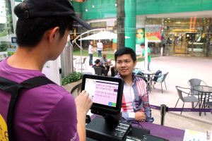 Chatime's cashier Choong taking customer orders using the new POS system