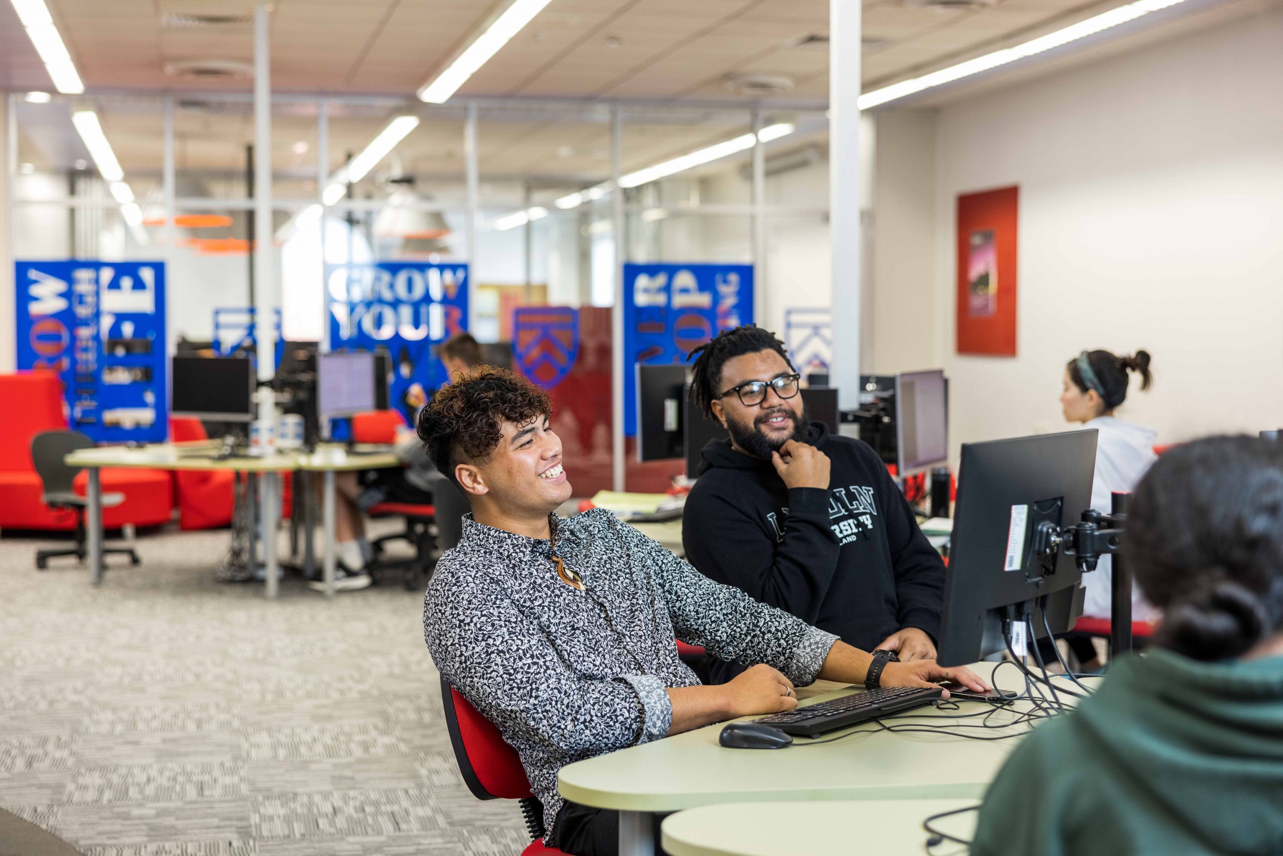students talking on computer