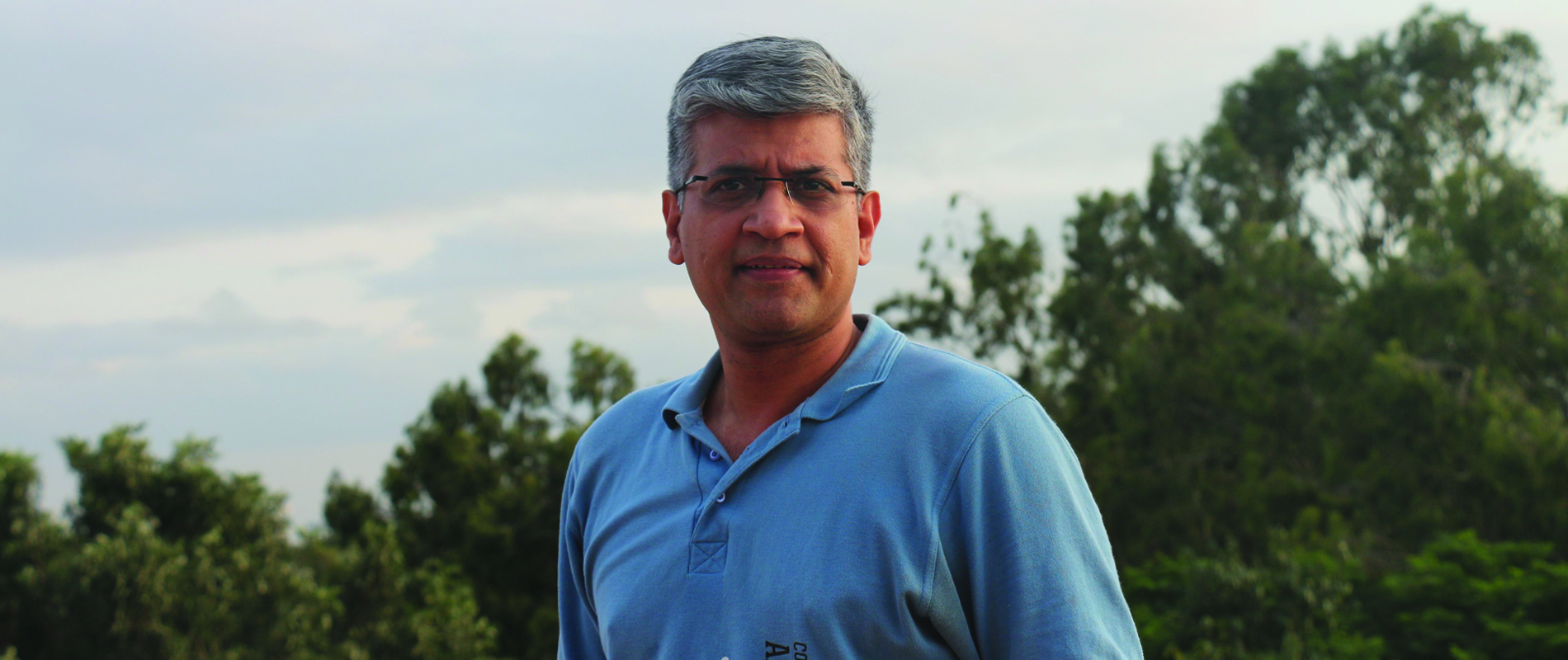 Dr Yogesh Simhann standing