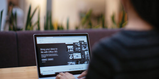 A girl using laptop with high contrast mode setting