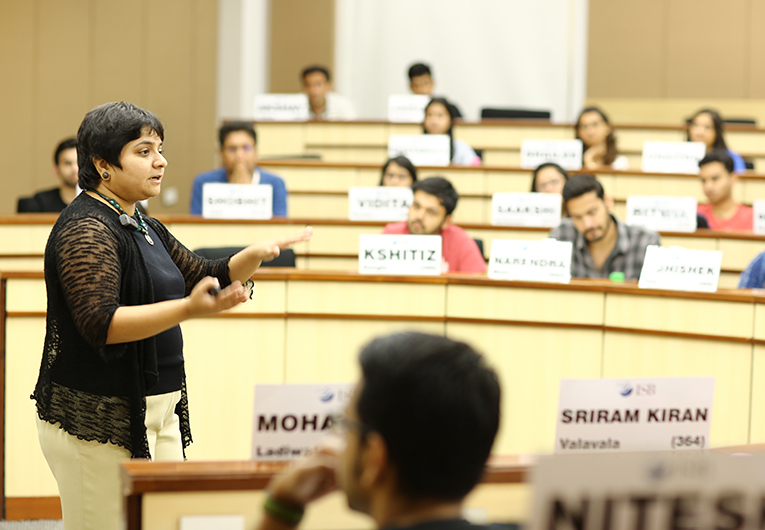 A female professor giving a lecture