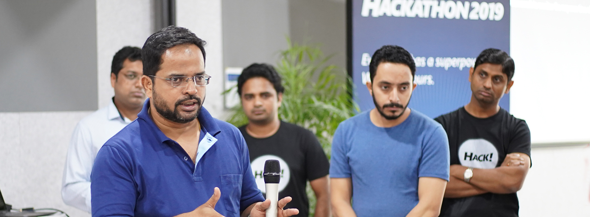 A team giving a presentation at a corporate event