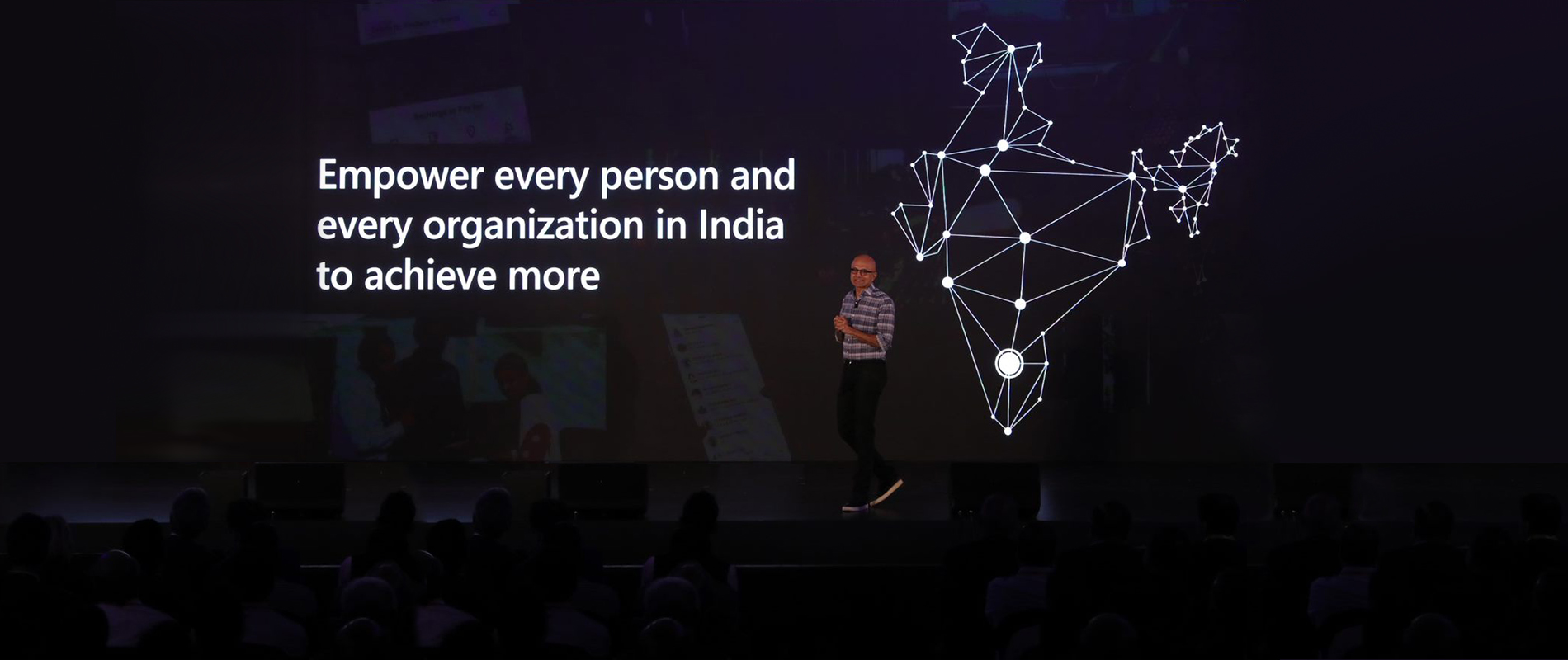 Satya Nadella, CEO of Microsoft, addresses tech leaders and developers at Future Decoded: Tech Summit, Bengaluru. Also seen is the backdrop with the text 'Empower every person and organization in India to achieve more.'