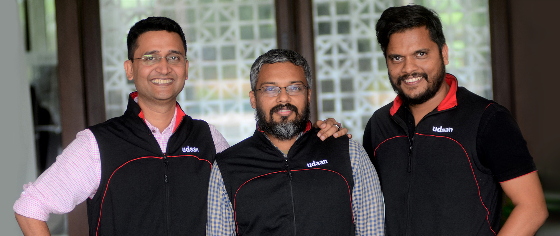 From left to right, Amod Malviya, Vaibhav Gupta and Sujeet Kumar, co-founders of Udaan, similing at the camera