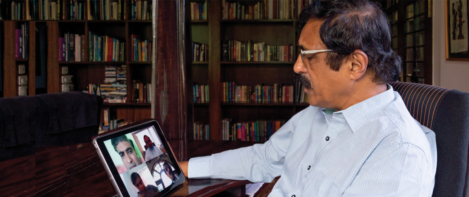 Dr BS Ajai Kumar, CEO and Chairman, HealthCare Global (HCG), using Microsoft Teams on his ipad