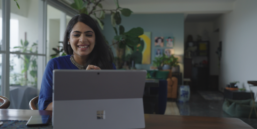 a woman working on a Surface Pro