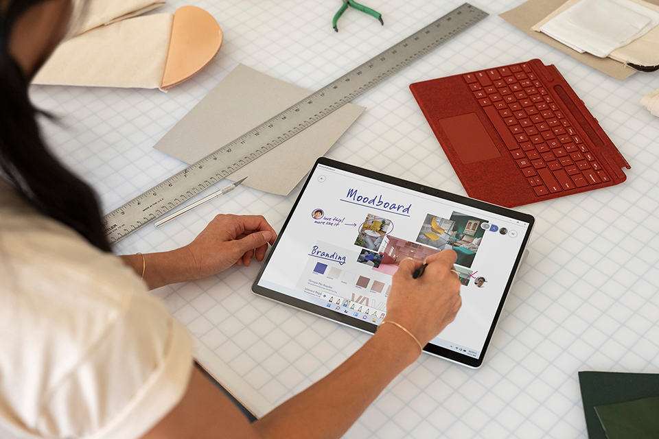A woman using the Surface device