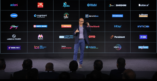 satya nadella delivering a keynote on stage