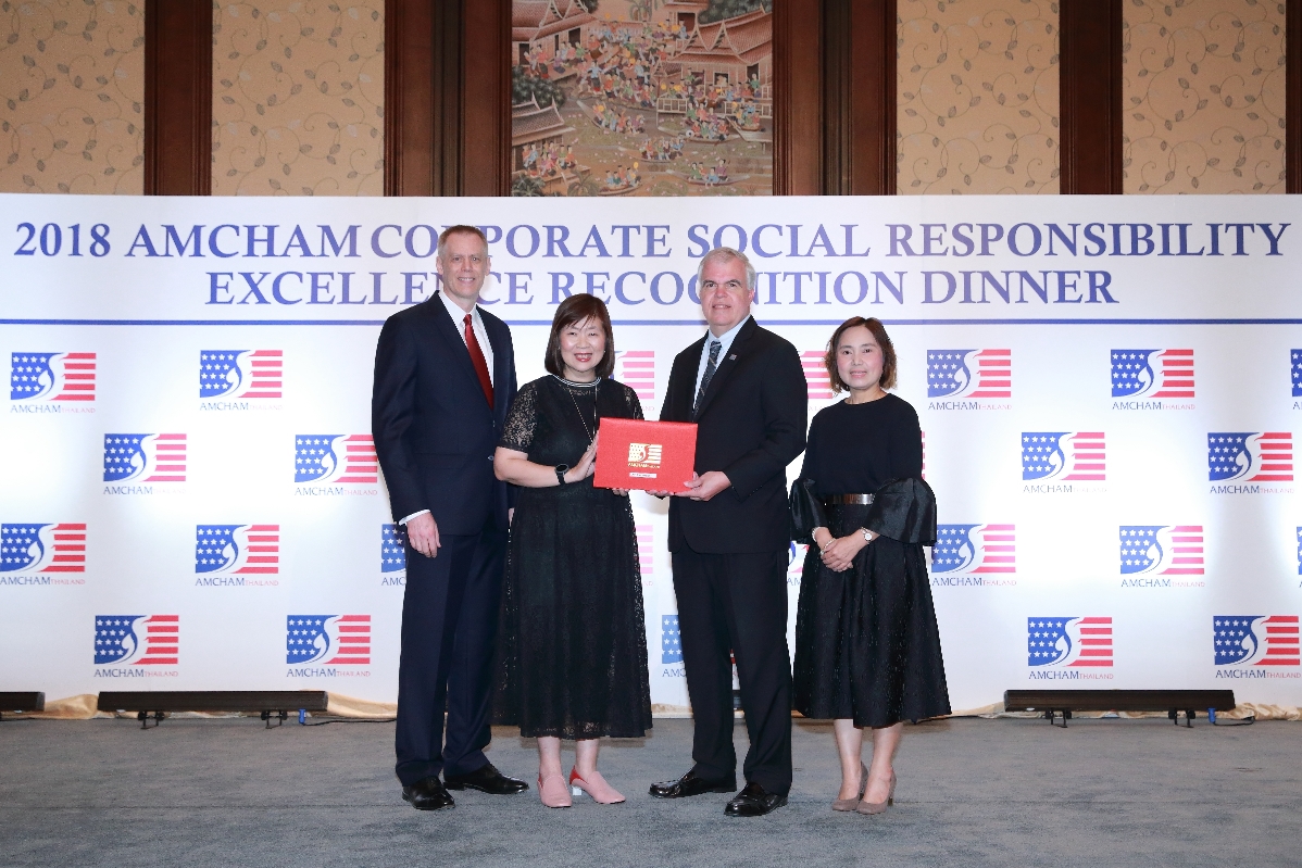 Men and women in awards ceremony