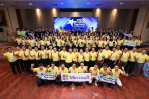 Group of people in yellow shirts in event