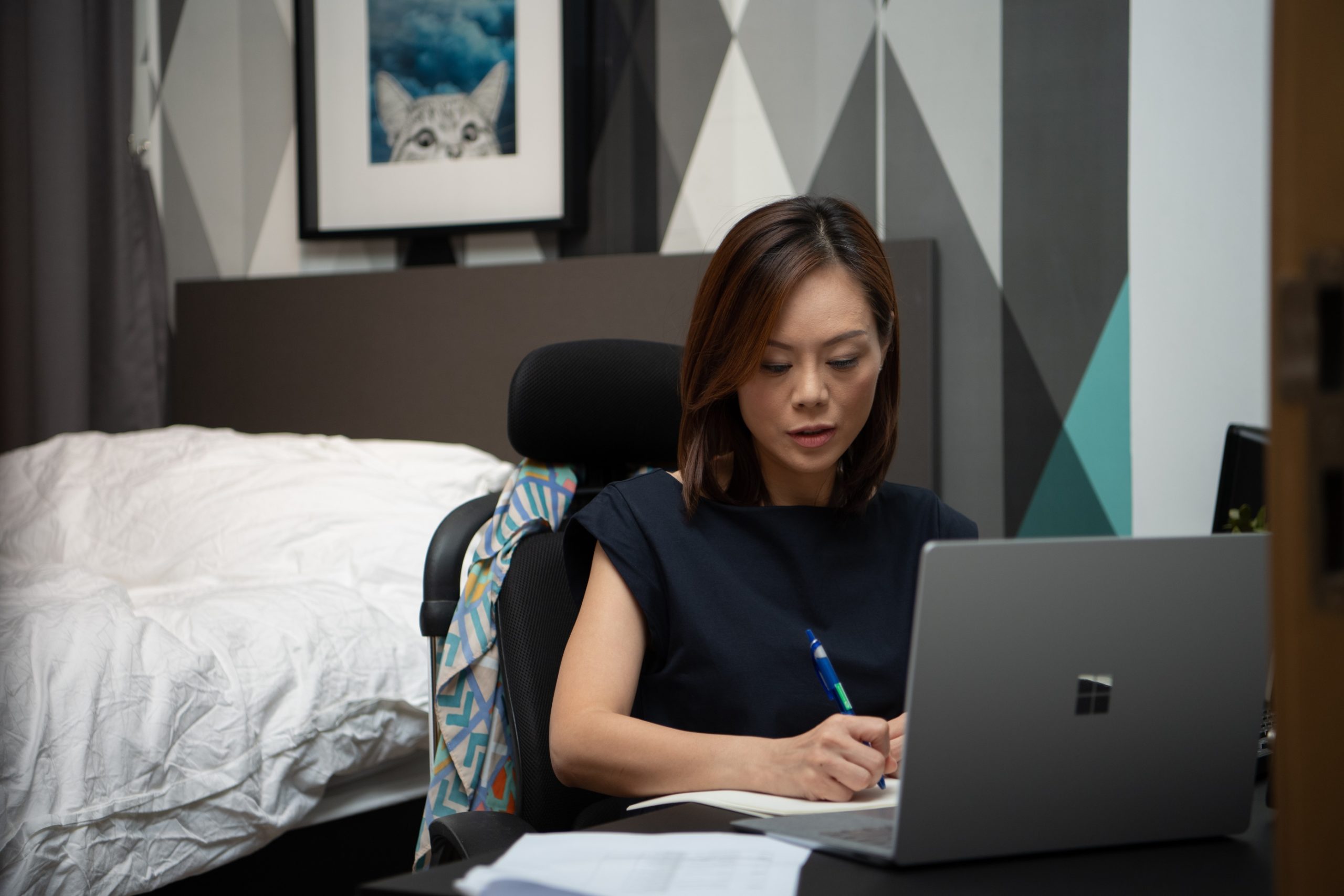 Woman working on a laptop at home
