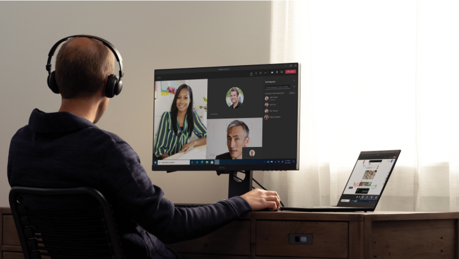 A man taking part in a Teams call from home