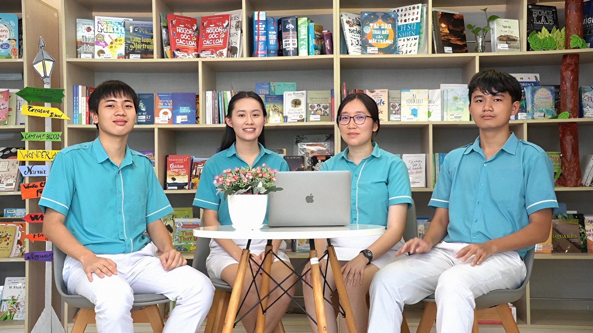 4 members of Intellilex team sitting in the library
