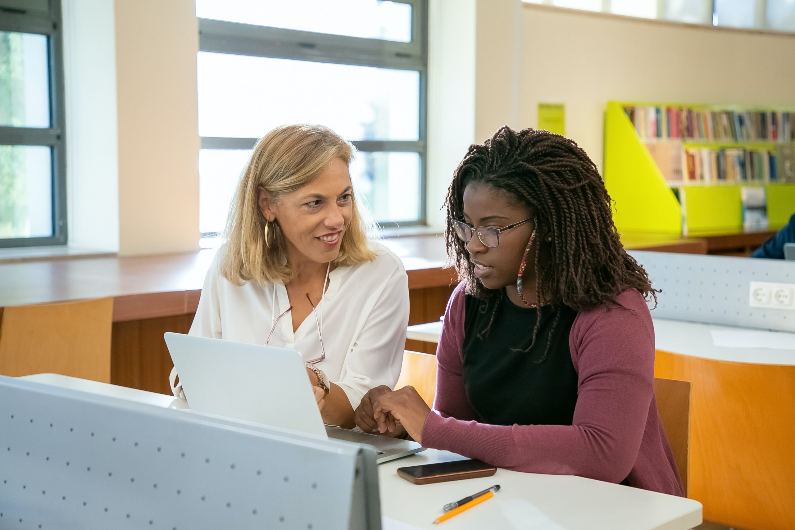Two women in a classroom