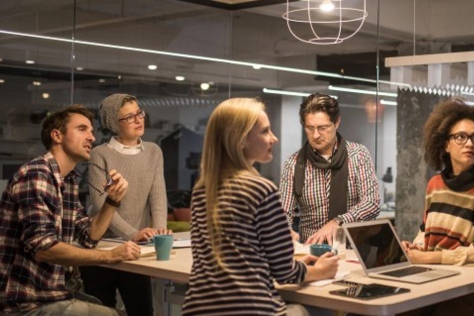Photo of six people in a meeting room