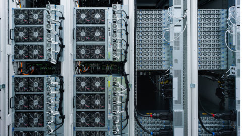 Microsoft datacenter hot aisle tall server racks zoomed in, showing fans, cords and cables