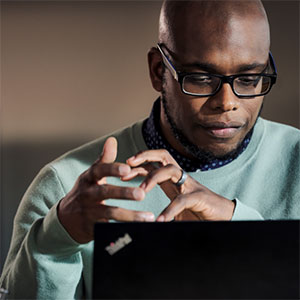man works on a laptop