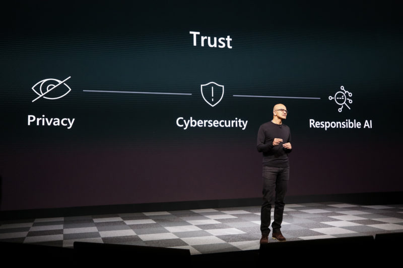 Microsoft CEO Satya Nadella stands on a stage during the MWC Barcelona event