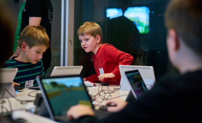 kids programing in Minecraft on Surface Go