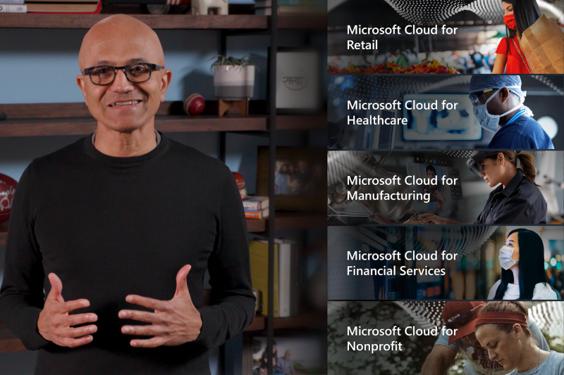 Satya Nadella stands in front of a shelf